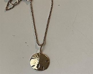 gold sand dollar pendant and chain
