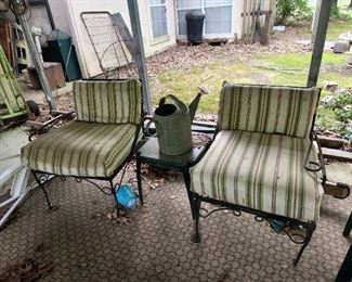 Outside furniture under carport, table, watering can