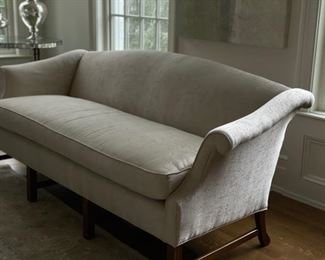 Antique camelback sofa upholstered in neutral silver chenille fabric. Measures 78" W x 32" D. Photo 1 of 3. 
