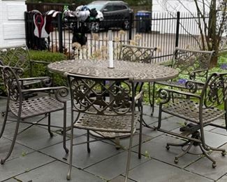 Williams Patio Furniture oval wrought iron dining table and set of 6 chairs - 2 swivel and four arm chairs. Photo 1 of 5. 