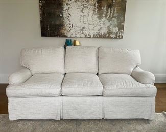Walter E. Smithe three-seat neutral upholstered sofa. Measures 82" W  x 40" D. Photo 1 of 4. 