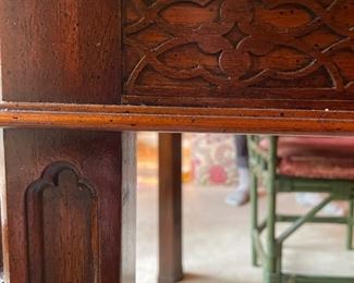 Burl wood extension table with fretwork trim. Measures 62" L  x 44" W x 30" H; extends to 104" W with two 21" Leaf.  26" clearance. Photo 5 of 5. 