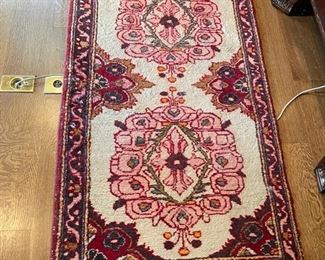 Persian rug. Measures approximately 53" x 30."