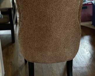 Set of 2 cheetah print upholstered dining chairs with nailhead trim. Photo 2 of 3. 