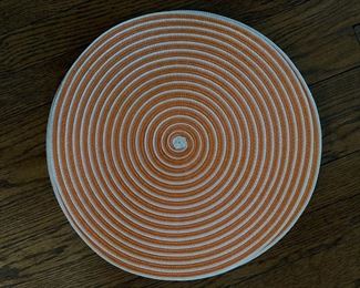 Set of 8 orange and white spiral placemats. 