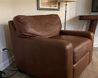 Leather upholstered club chair. There is some claw damage on the lower left side.  Photo 2 of 3. 