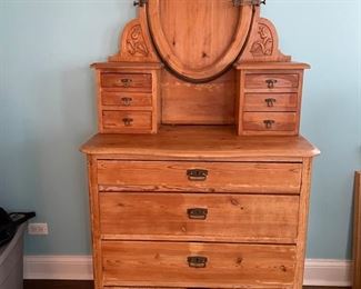 Antique Victorian-style hand-carved pine chest of drawers with two brass swing arm candle holders. Measures 37" W x 21" D x 73" H. Photo 1 of 4. 