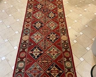 Hand-knotted wool rug measures 117" x 30". Photo 1 of 2. 