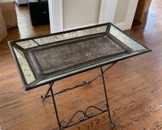 Antiqued Glass Side Table. Measures 18” x 13” x 20” H. 