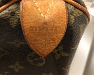 LABEL OF AUTHENTIC LOUIS VUITTON PURSE