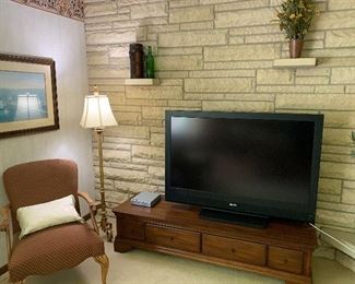 Flatscreen TV, TV stand, wouldn’t arm side chair and floor lamp