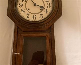 Antique  clock with pendulum and key