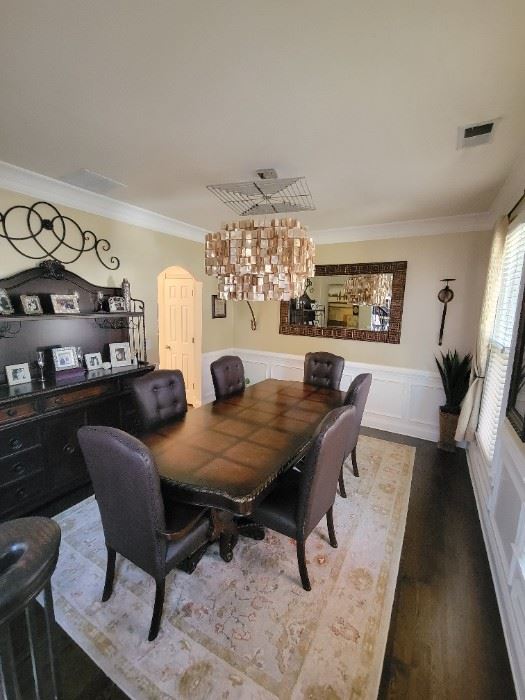 Dining room expandable table with six chairs and hutch. (chairs scratched by cats but can easily be fixed).