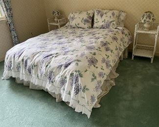 Full sized bed with matching wicker end tables