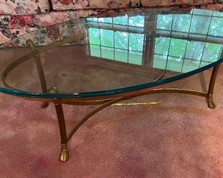 Brass base with oval glass top coffee table