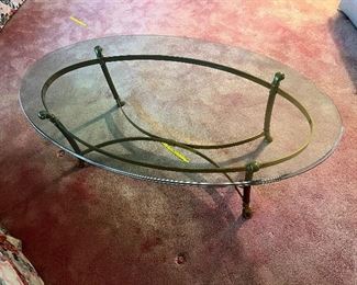 Brass base with oval glass top coffee table