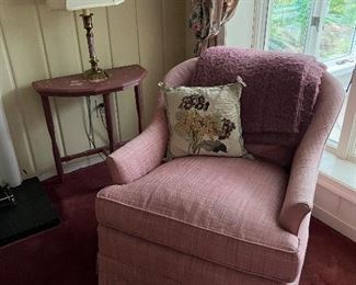 Pink upholstered armchair with pink side table & lamp