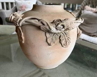 Unglazed ceramic floral vase
