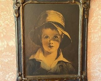 Portrait of a young boy with ornate frame