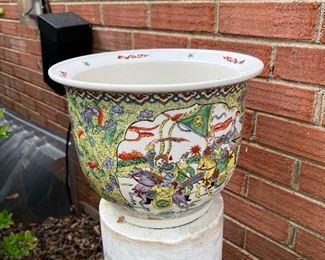 Antique Oriental pot atop a Marble pillar
