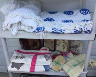 Fun chenille spreads, coverlet, so much wall art, woven bag and hat in Hawaiian cloth covers