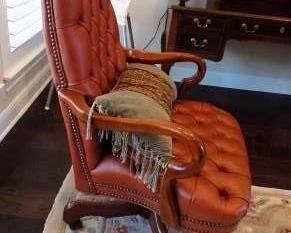 LEATHER EXECUTIVE OFFICE CHAIR - COMFORTABLE.  RUST ORANGE COLORED LEATHER