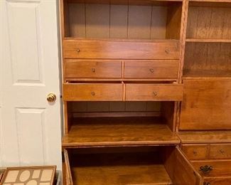 Left side has top and bottom storage with  middle drawers