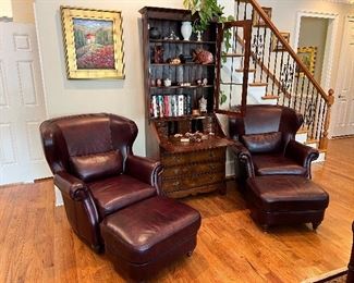 Pair of Bradington Young leather chairs with ottomans. 