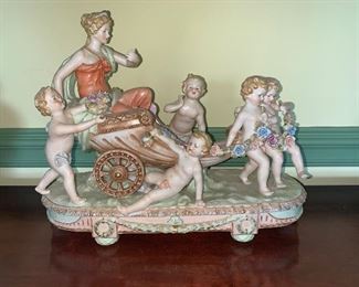 Monumental Dresden/Chelsea Group type woman in a coach with five putti 