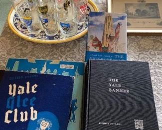Several items from Yale University, including vintage drinking glasses from the different colleges. Yearbooks from the 1950s, Glee Club records, 5 different etchings, including 3 by Selwyn