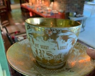 Antique golden white cup and saucer