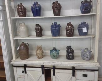 lots of face jugs by various artist from ga to nc