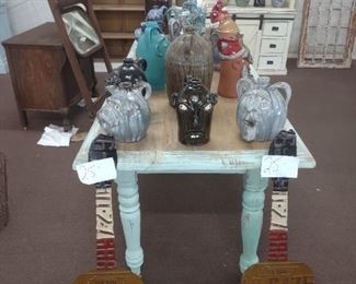 tag art and face jugs and 8 ft farm table