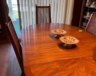 Midcentury Table with 3 leaves and 6 chairs, 2 need simple repairs. Pedestal base.