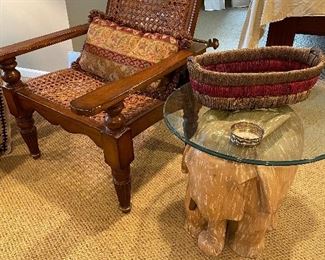 Plantation reclining armchair with wicker and brass recliner rod; elephant table with glass top