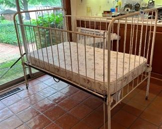 Vintage metal crib that was used by 3 generations of the homeowner's family