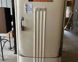 Vintage General Electric refrigerator with small freezer compartment; works well