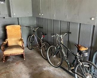 Bicycles and an upholstered rocker