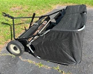 Lawn leaf sweeper that can be pulled behind a riding lawnmower