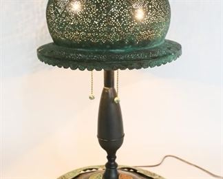 2	Art Nouveau Style Table Lamp with Copper Shade	"Art Nouveau style table lamp with copper shade. 
Copper shade has some breakage and base medallion rusted. 
24"" H x 12 3/4"" Base diameter."
