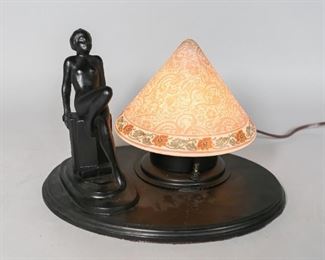 24	Art Nouveau Figural Lamp With Bellova Shade	"Art nouveau figural lamp with nude statue and stamped ""Czechoslovakia Bellova #1634"" glass shade.
Some notches to wood stand.
8"" H x 12"" L."

