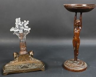 32	Figural Tray and Inkwell	"Art Nouveau figural ink stand with glass inkwell and stopper. Art Deco painted metal nude stand with tray. Art Deco painted metal stand: 11 1/4"" H x 5 1/2"" tray diameter. Wear to paint on figure and to the interior of the tray. Inkwell detached from inkstand. 
"
