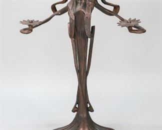 38	Art Nouveau Figural Patented Metal Candlestick	"Art Nouveau figural patented metal candlestick.
17 1/2"" x 7 1/2""."
