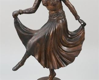 48	Art Deco Dancer Painted Metal Sculpture	Art Deco dancer painted metal sculpture. In the style of Chiparus. 19 1/2" H x 10 1/4" W.  Wear to paint on back of skirt.
