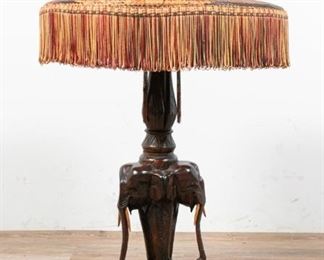 73	Carved Wooden Elephant Table Lamp	"Carved wooden elephant table lamp with rattan tassel shade and 2 lights. 
Overall: 34"" x 8"" base diameter. 
"
