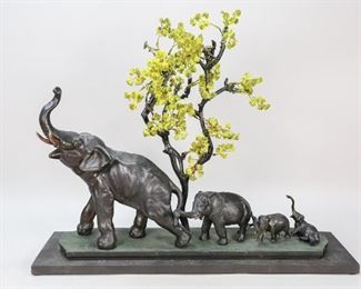 78	Metal Statue of Elephants and Tree	"Metal statue of 4 elephants and  tree on wooden base.
Minor paint loss on elephants.
22"" x 26 1/2"" x 7 1/4""."
