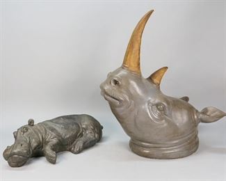 90	Rhinoceros Bust and Resting Hippopotamus Sculpture	"Rhinoceros bust and resting hippopotamus sculpture. 20th Century. Plaster and composite rhino bust, concrete hippo. Appears unsigned. Some loss on bottom of rhino bust, pitting to hippopotamus. 

Rhino measures 25"" H x 12"" L x 11"" W"
