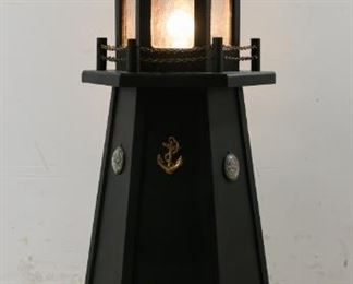 96	Lighthouse Floor Lamp	"Lighthouse floor lamp. American, 20th Century. Lighthouse form lamp with maritime motifs on body, glass top containing bulb on top. Lamp has been tested and works, blinking on and off in intervals like a real lighthouse. 

38"" H x 16"" L (of base)"
