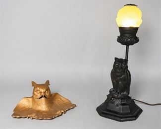 93	Two Owl Decorative Accessories	"Two owl decorative accessories. American, 20th Century. A cast metal owl inkwell, marked 4536 on base with glass ink insert. Figural owl desk lamp, metal with black paint, owl head form uranium glass shade. Lamp has been tested and works. Scratches around owl base, slight loss to patina on inkwell. 

Lamp measures 15"" H x 6"" L of shade"
