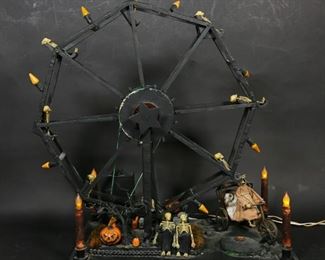 106	Halloween Skeleton Folk Art Ferris Wheel	"Halloween skeleton folk art Ferris wheel. American, Late 20th Century. Black painted Ferris wheel with skeleton riders, decorated with tea candles, jack o' lanterns, and orange lighting. Ferris wheel has been tested and works, spinning in intervals. Illumination on orange Ferris wheel bulbs not working properly. Front left tealight is loose. 

30"" H x 25"" L x 15"" D"
